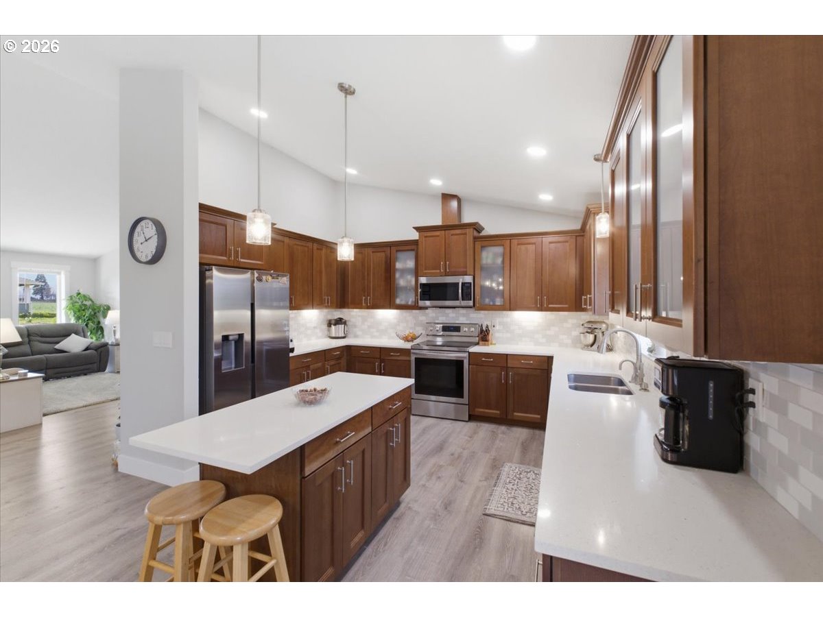 12008 Duck Inn Road Northeast Gervais, OR 97026 - Photo 15 of 48 a large kitchen with a table and chairs