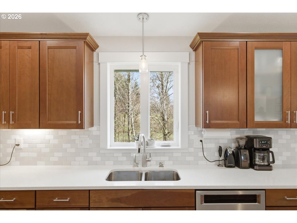 12008 Duck Inn Road Northeast Gervais, OR 97026 - Photo 18 of 48 a kitchen with a refrigerator and a sink