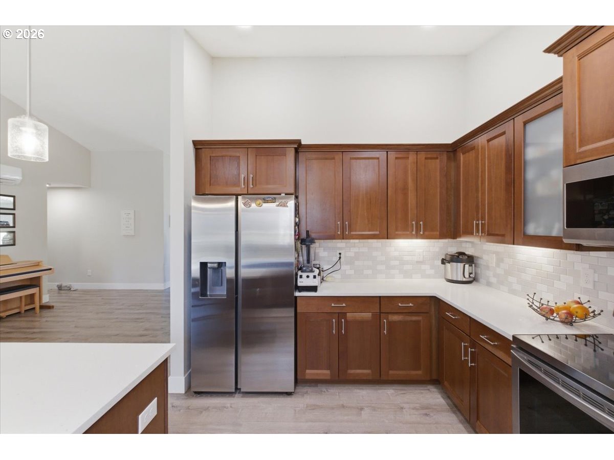 12008 Duck Inn Road Northeast Gervais, OR 97026 - Photo 20 of 48 a kitchen with a sink refrigerator and microwave
