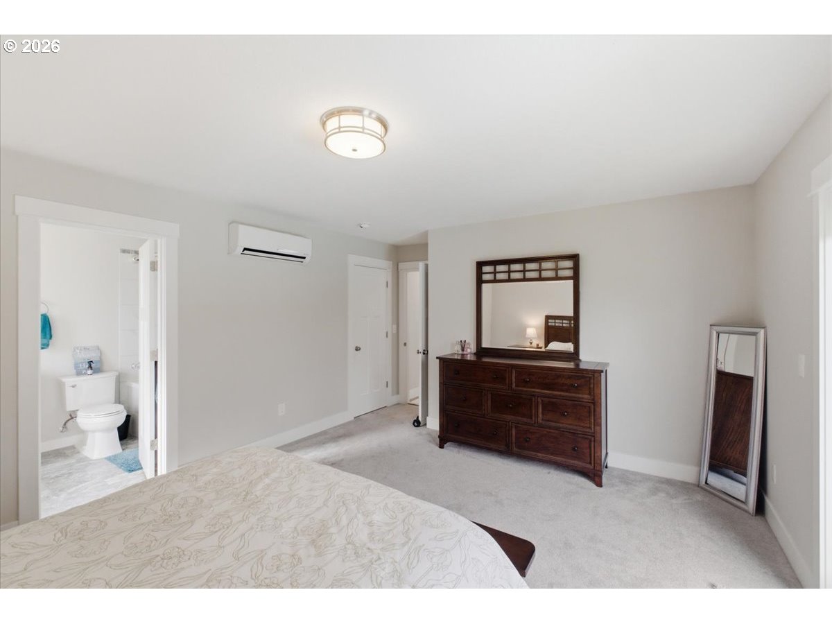 12008 Duck Inn Road Northeast Gervais, OR 97026 - Photo 21 of 48 a bedroom with a bed and a bathroom