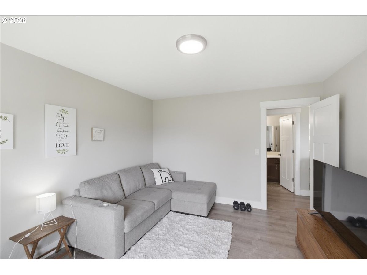 12008 Duck Inn Road Northeast Gervais, OR 97026 - Photo 29 of 48 a living room with furniture and a flat screen tv