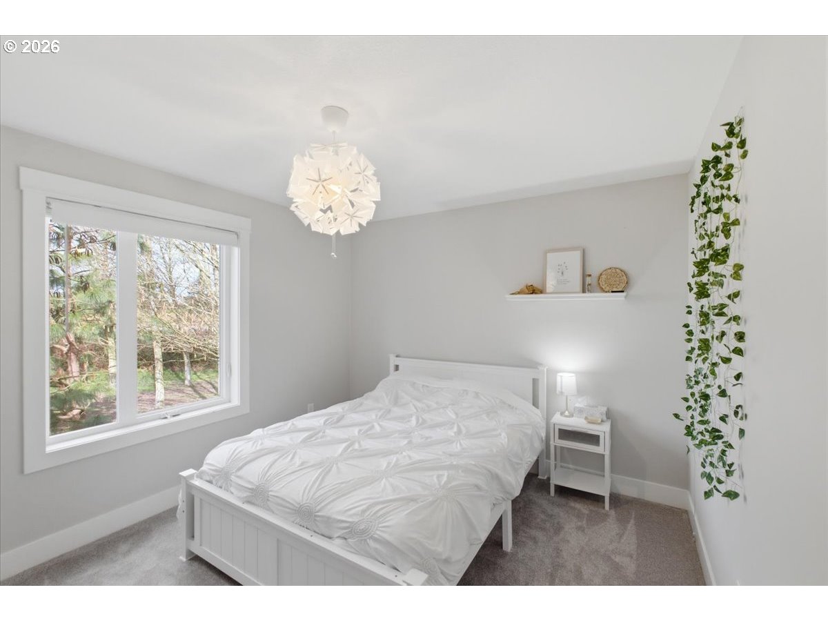 12008 Duck Inn Road Northeast Gervais, OR 97026 - Photo 31 of 48 a bedroom with a bed and a window