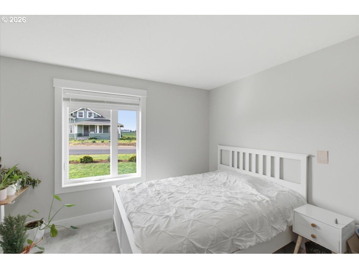 12008 Duck Inn Road Northeast Gervais, OR 97026 - Photo 33 of 48 a bedroom with a bed and a window