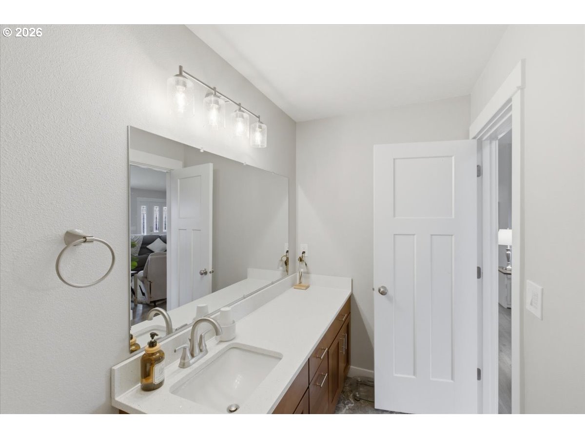12008 Duck Inn Road Northeast Gervais, OR 97026 - Photo 34 of 48 a bathroom with a sink vanity and mirror