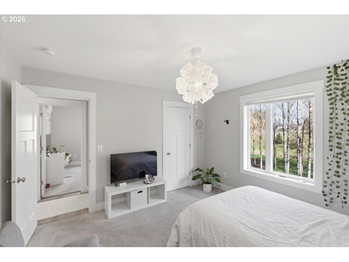 12008 Duck Inn Road Northeast Gervais, OR 97026 - Photo 36 of 48 a living room with furniture and a flat screen tv