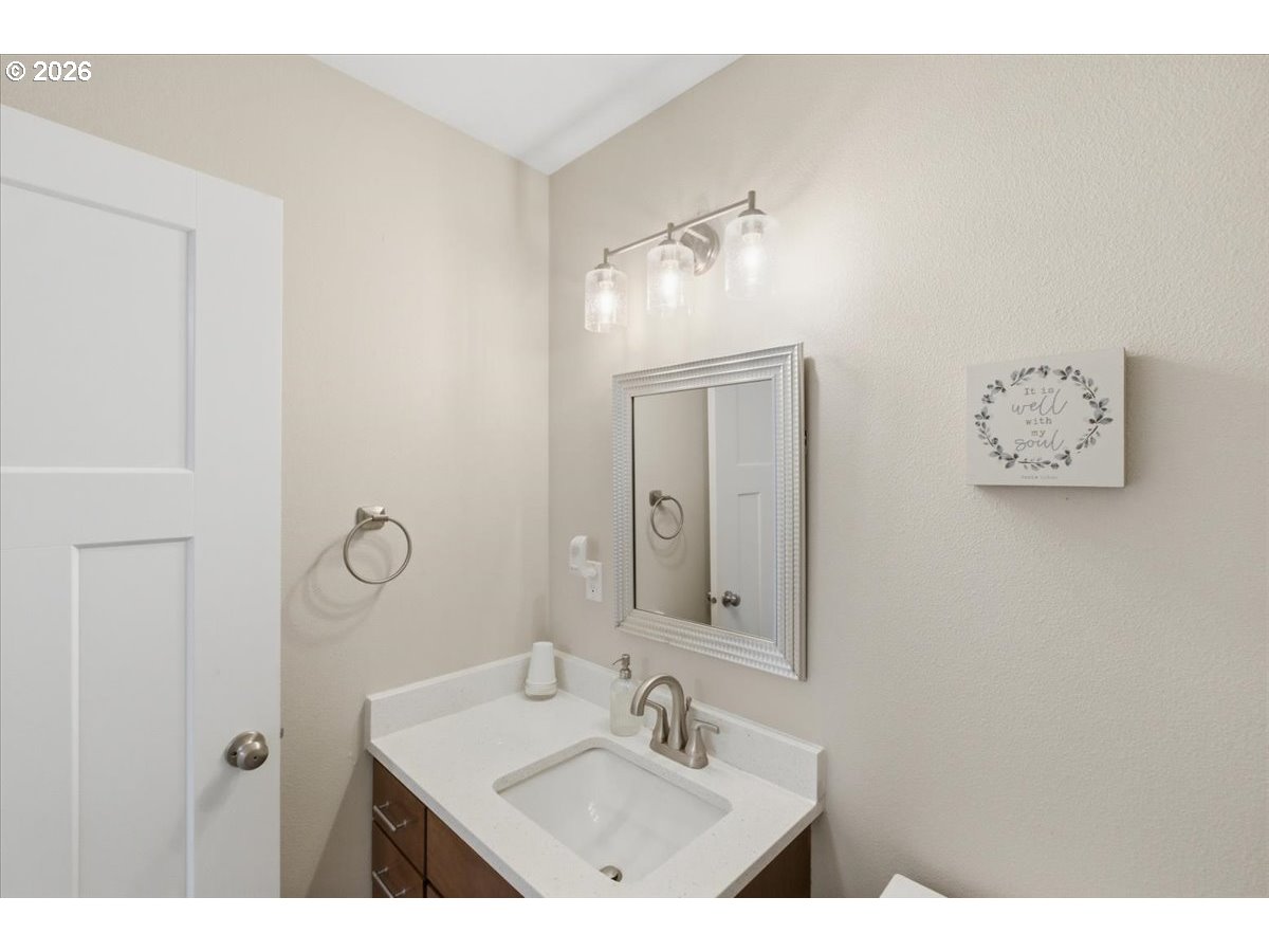 12008 Duck Inn Road Northeast Gervais, OR 97026 - Photo 37 of 48 a bathroom with a sink vanity and a mirror