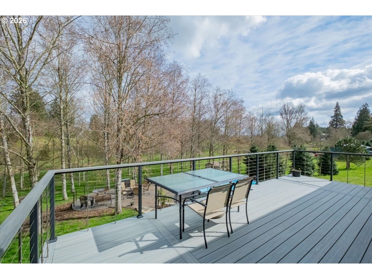 12008 Duck Inn Road Northeast Gervais, OR 97026 - Photo 39 of 48 a view of a chairs and table on the wooden floor