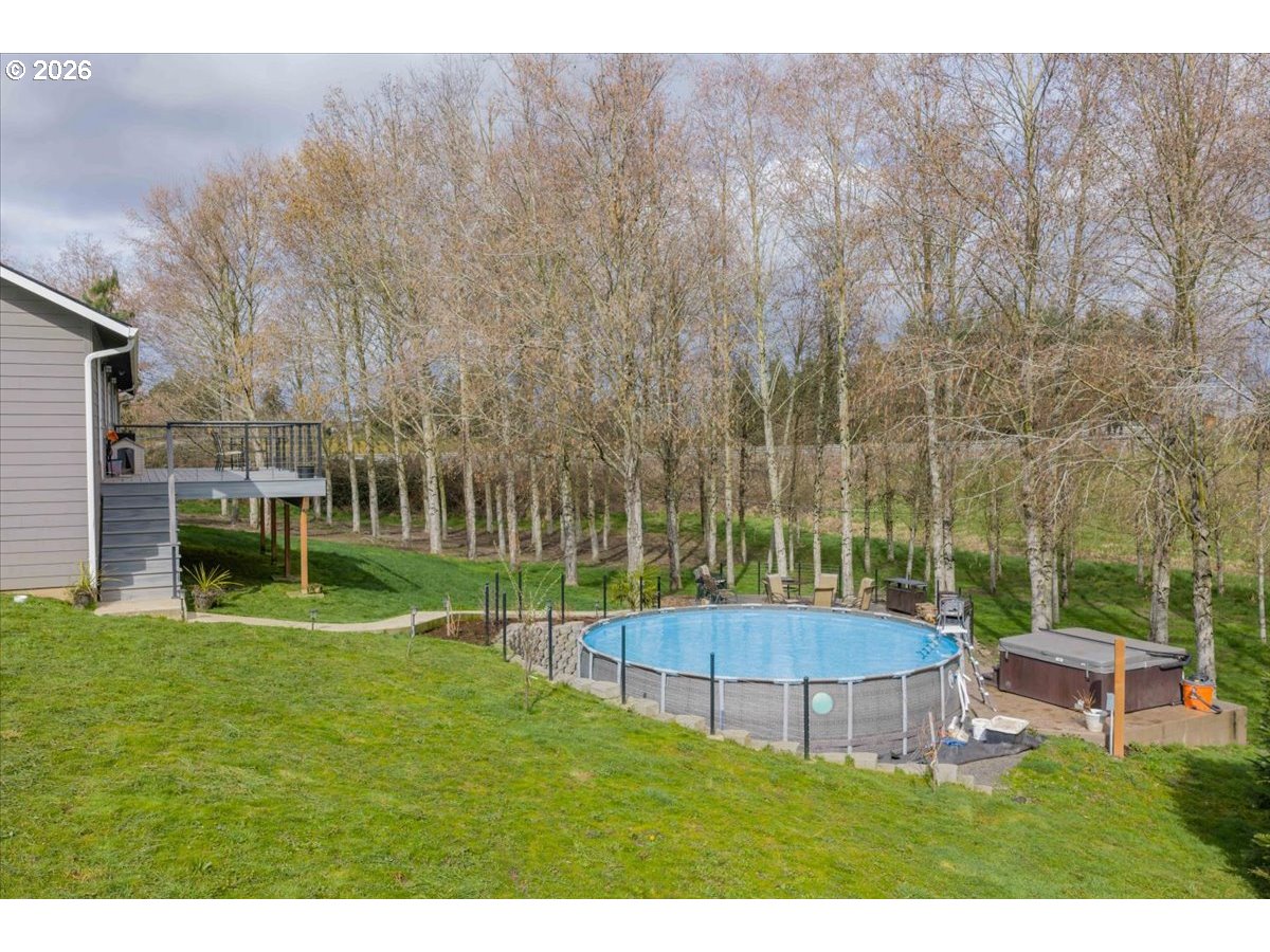 12008 Duck Inn Road Northeast Gervais, OR 97026 - Photo 40 of 48 a view of a backyard with a garden and entertaining space
