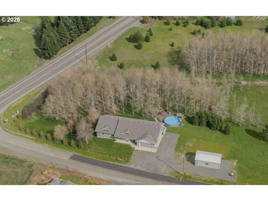 12008 Duck Inn Road Northeast Gervais, OR 97026 - Photo 47 of 48 a view of a yard with a tree