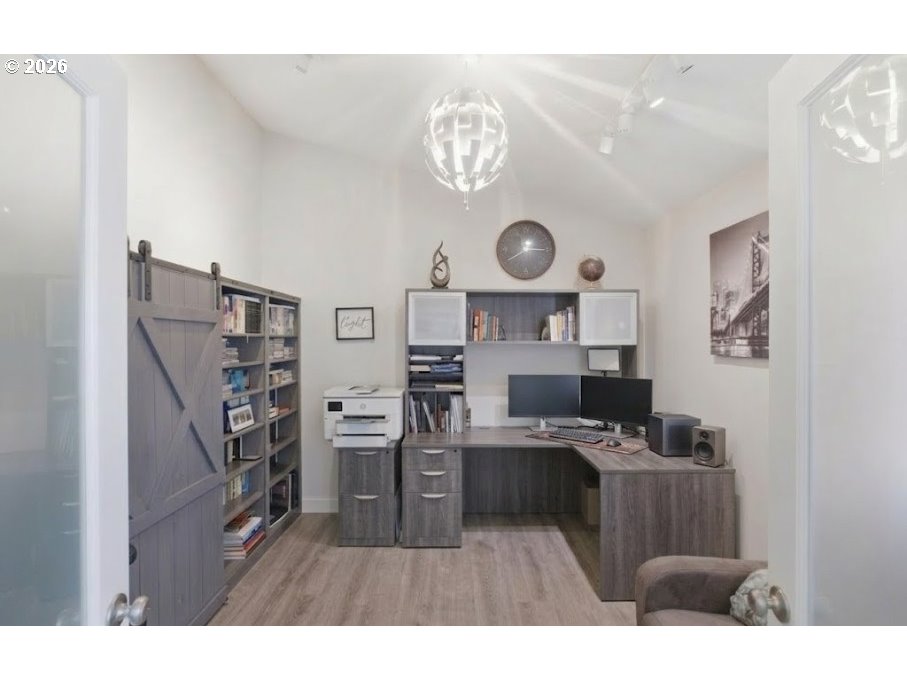 12008 Duck Inn Road Northeast Gervais, OR 97026 - Photo 8 of 48 a living room with stainless steel appliances a stove top oven a clock and a bookshelf