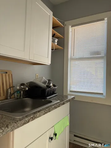 a kitchen with a sink and cabinets
