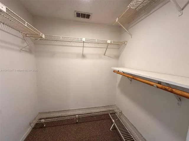 a view of a room with racks on the wall
