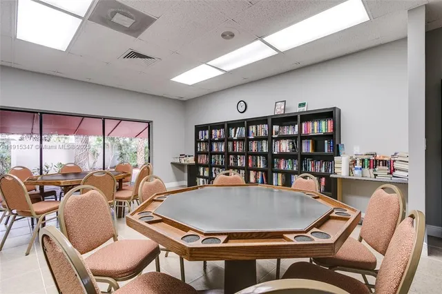 a front view of a house with a garden and yard