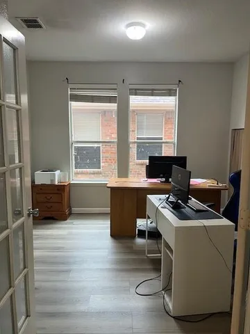 a workspace with furniture and a window