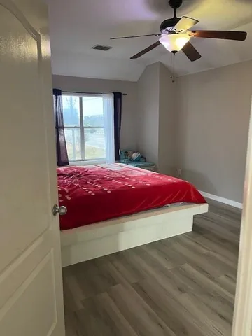 a room with a bed and a window