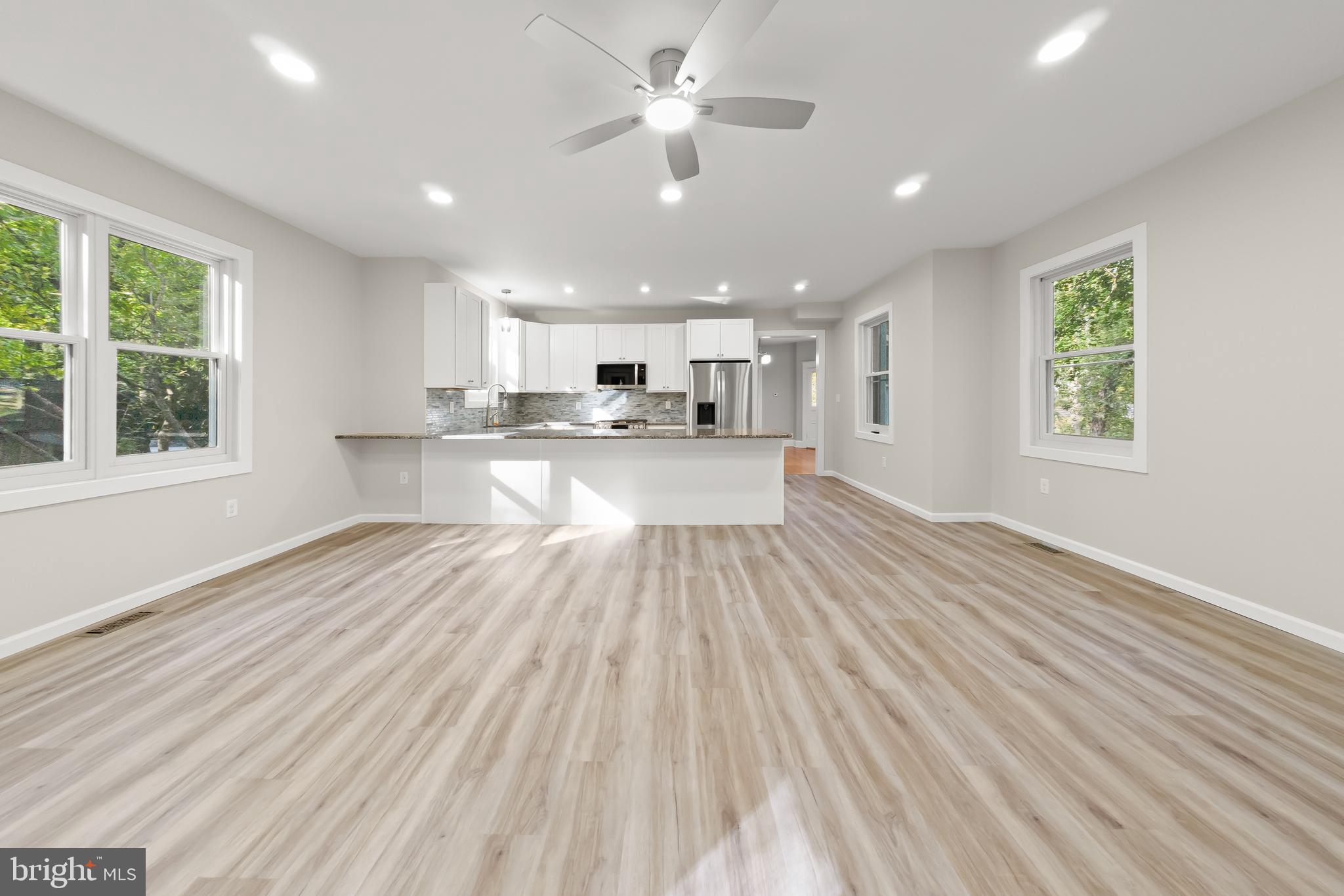 10220 Capitol View Avenue Silver Spring, MD 20910 - Photo 22 of 62 Family room with ceiling fan and recessed lights