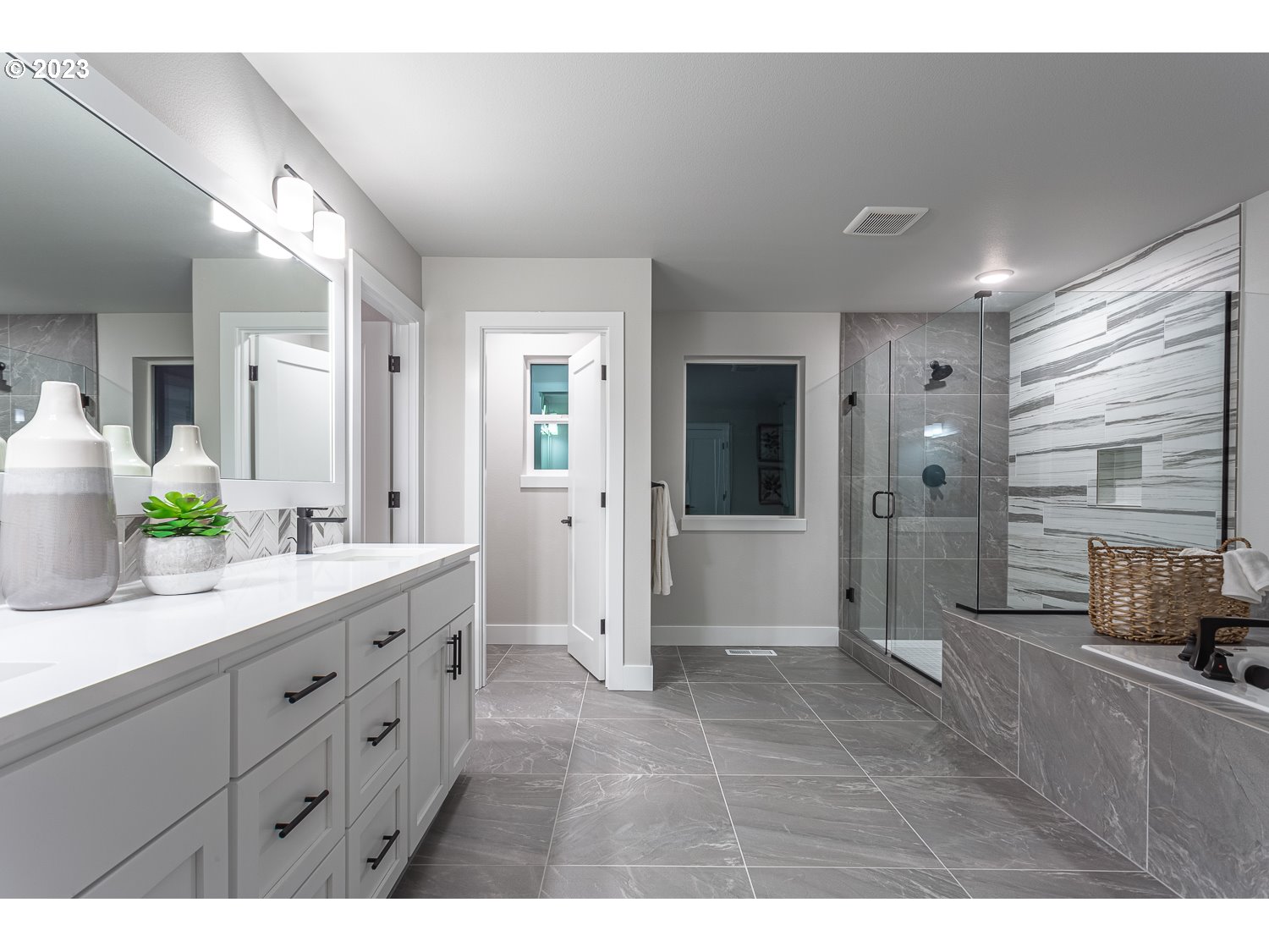 15594 Southwest Peace Avenue Tigard, OR 97224 - Photo 15 of 24 a bathroom with a double vanity sink mirror and shower