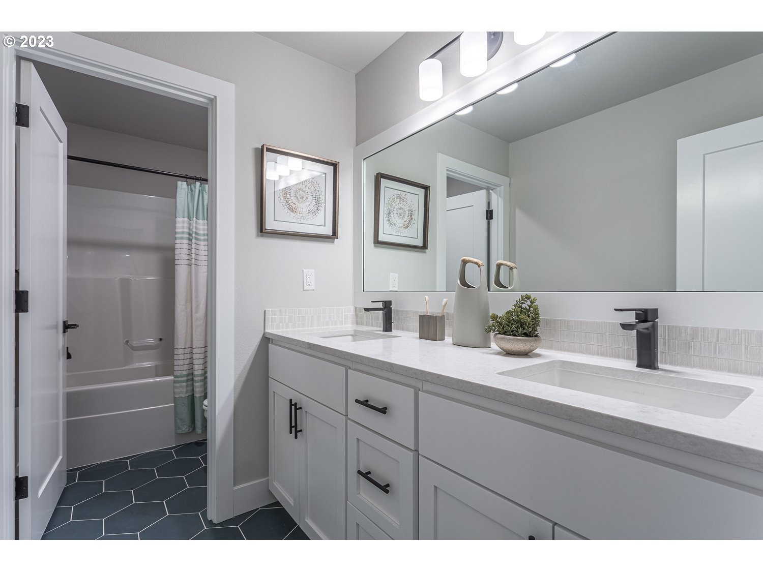 15594 Southwest Peace Avenue Tigard, OR 97224 - Photo 21 of 24 a bathroom with a granite countertop sink mirror and a