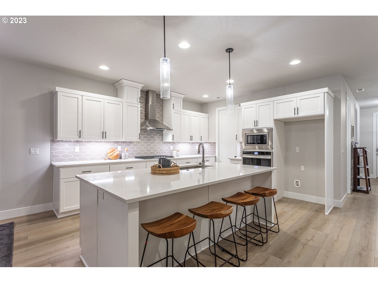 15594 Southwest Peace Avenue Tigard, OR 97224 - Photo 6 of 24 a kitchen with kitchen island a sink stove and refrigerator