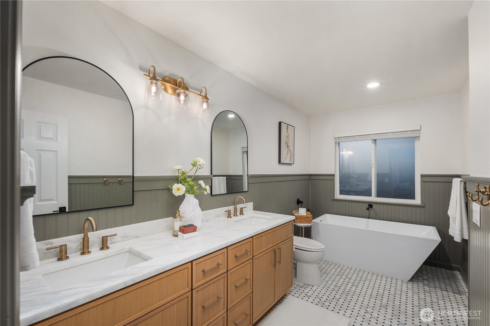 832 Harvest Road Bothell, WA 98012 - Photo 13 of 32 a bathroom with a double vanity sink and mirror