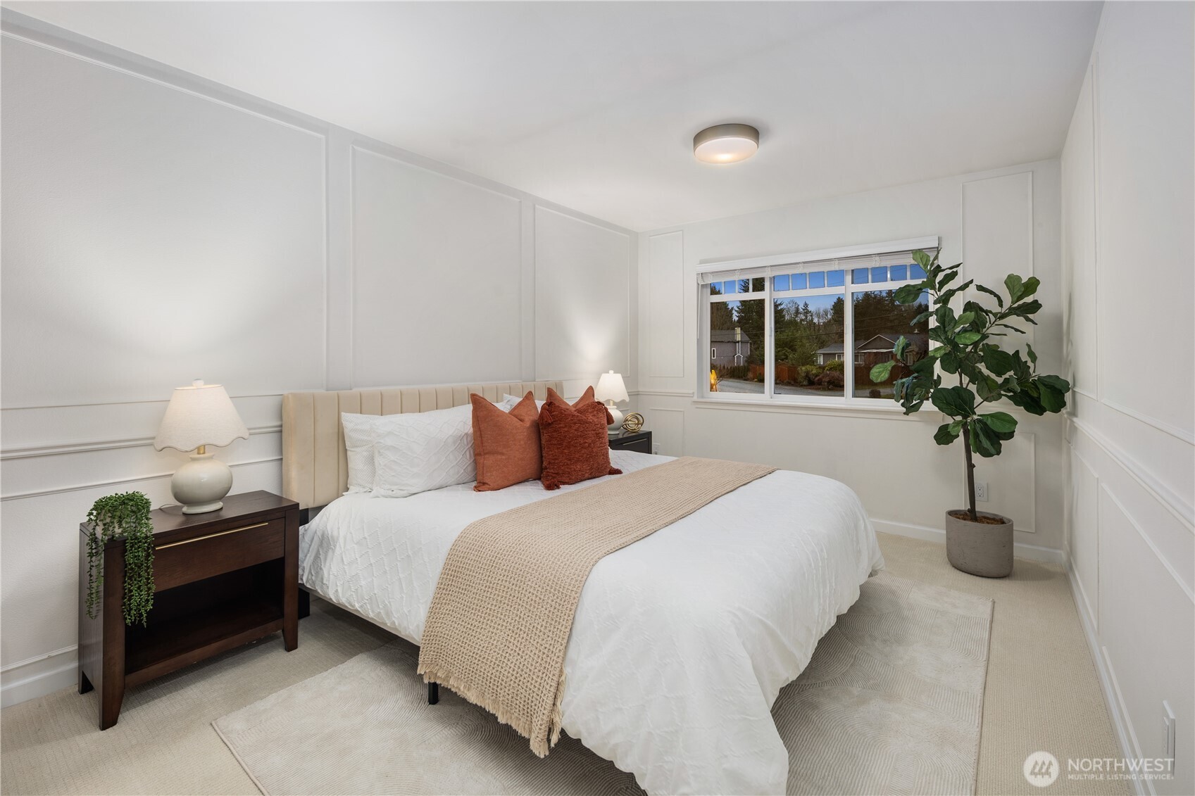 832 Harvest Road Bothell, WA 98012 - Photo 18 of 32 a bedroom with a bed and a potted plant