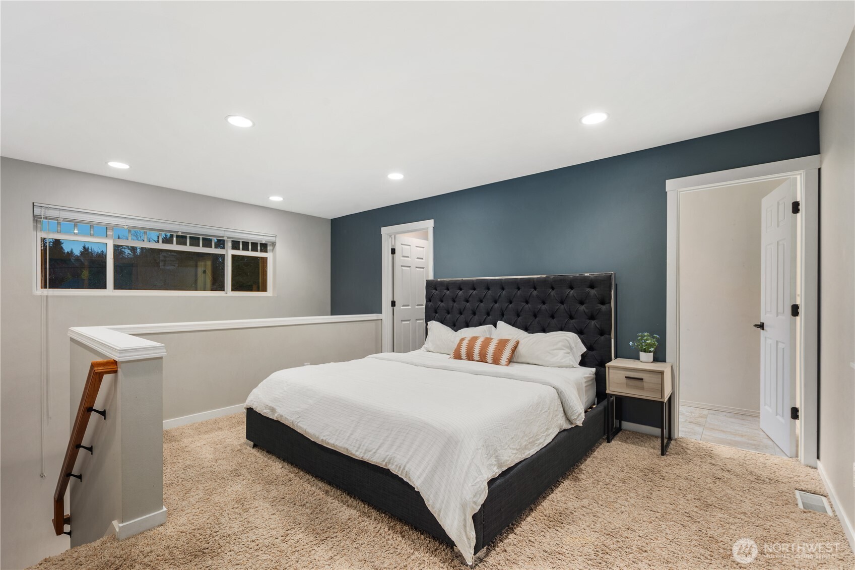 832 Harvest Road Bothell, WA 98012 - Photo 25 of 32 a bedroom with a large bed and a flat screen tv