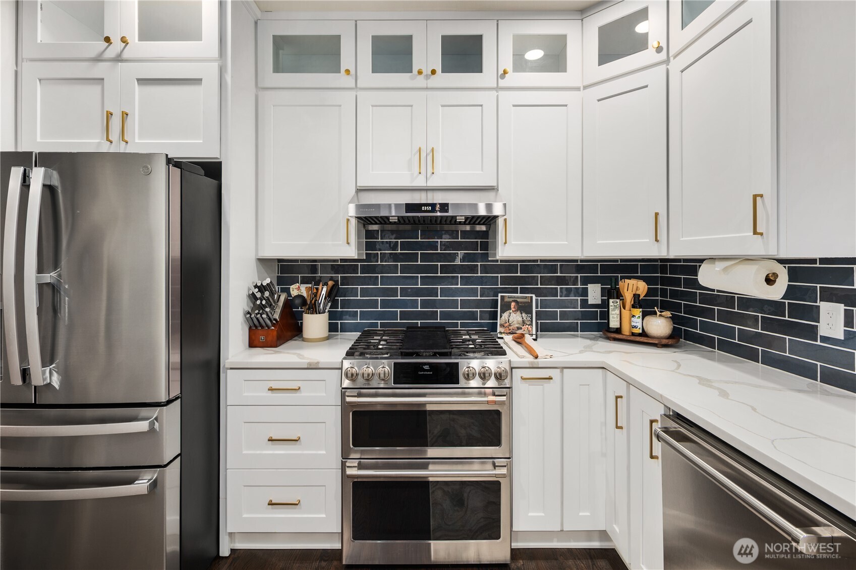 832 Harvest Road Bothell, WA 98012 - Photo 6 of 32 a kitchen with stainless steel appliances white cabinets and a stove top oven