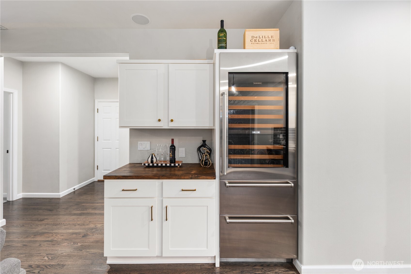832 Harvest Road Bothell, WA 98012 - Photo 7 of 32 a kitchen with granite countertop a refrigerator and cabinets