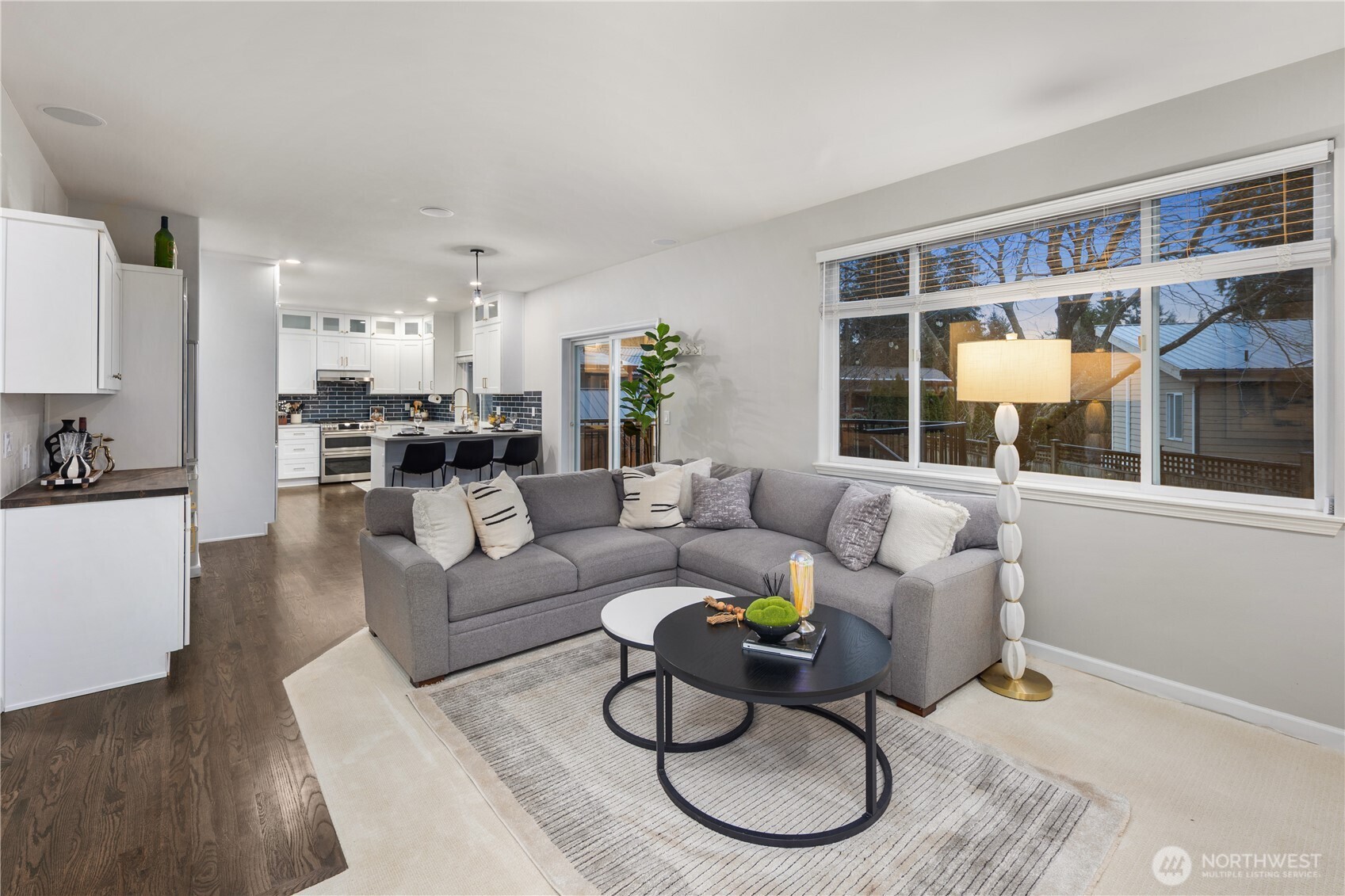 832 Harvest Road Bothell, WA 98012 - Photo 9 of 32 a living room with furniture potted plant and kitchen view