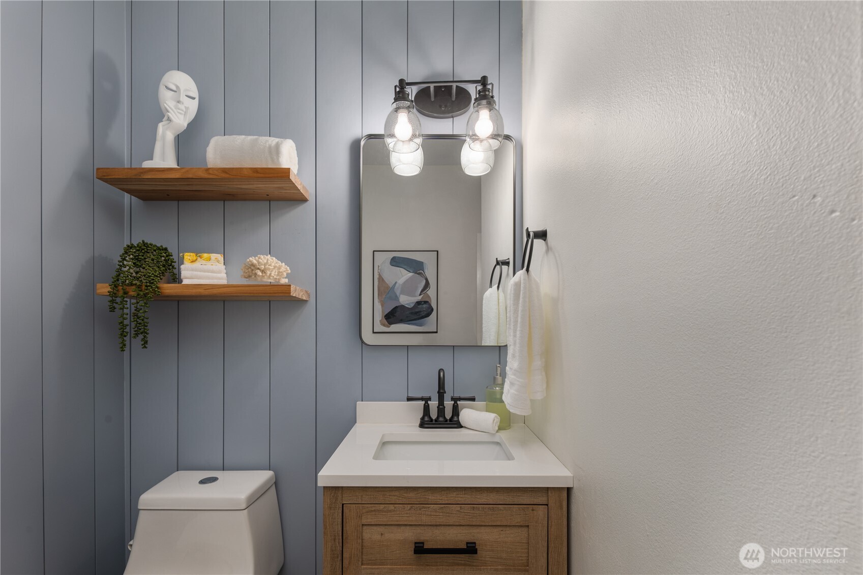 832 Harvest Road Bothell, WA 98012 - Photo 10 of 32 a bathroom with a sink toilet and a mirror