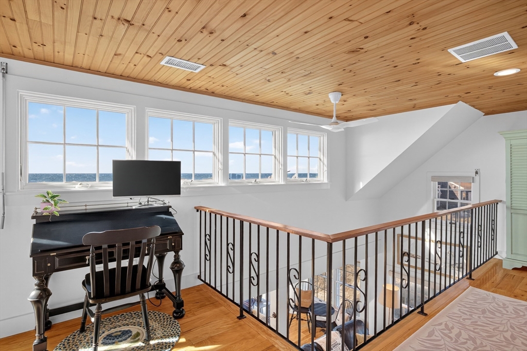 1145 Kingsbury Beach Road Eastham, MA 02642 - Photo 29 of 42 a bedroom with furniture and a window