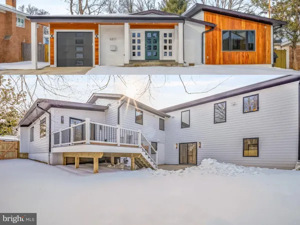 a front view of a building with a yard and garage