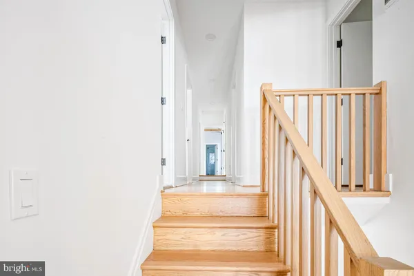 a spacious bedroom with a large bed and a couch