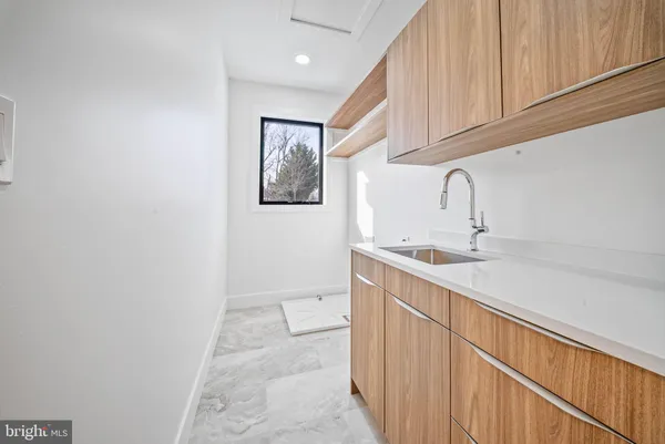 a view of a kitchen with a sink and a window