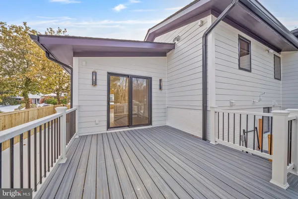 a view of a wooden deck with a yard