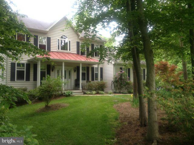 180 Walnut Creek Road Huntingtown, MD 20639 - Photo 1 of 6 a front view of a house with a yard
