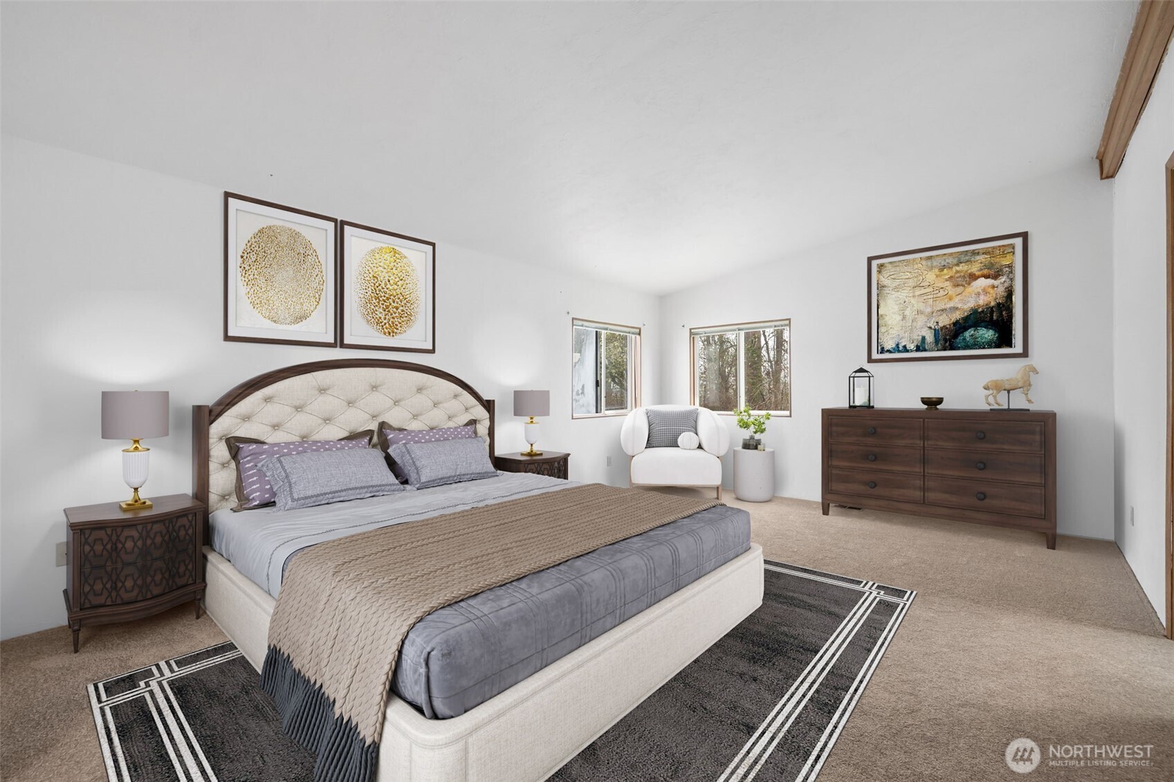 836 Harman Way South, Unit 33 Orting, WA 98360 - Photo 12 of 30 a bedroom with a bed and a painting on the wall