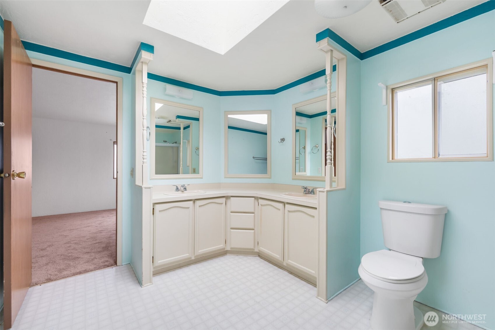836 Harman Way South, Unit 33 Orting, WA 98360 - Photo 16 of 30 a bathroom with a toilet sink and a mirror