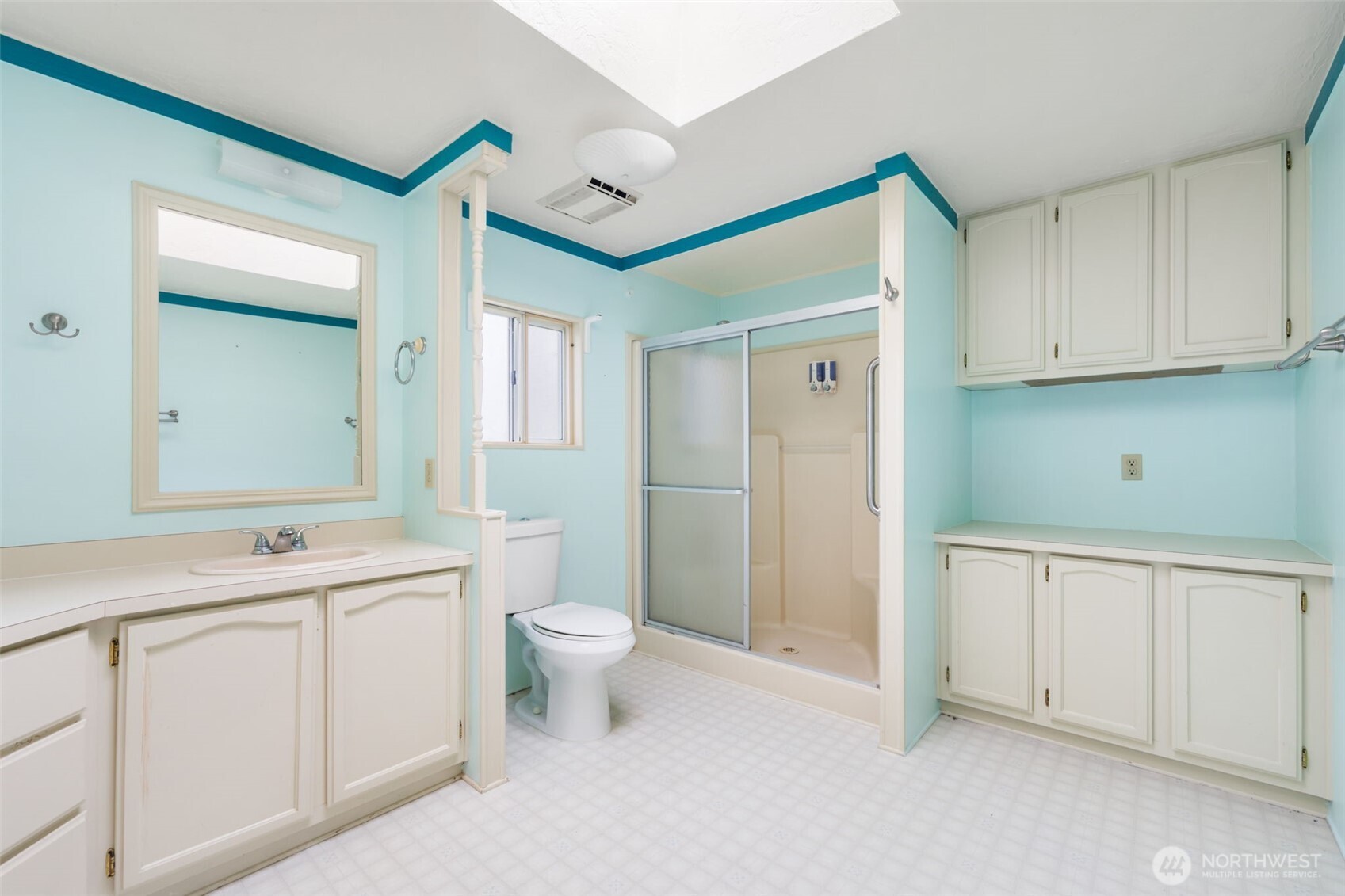 836 Harman Way South, Unit 33 Orting, WA 98360 - Photo 17 of 30 a bathroom with a toilet sink and a mirror