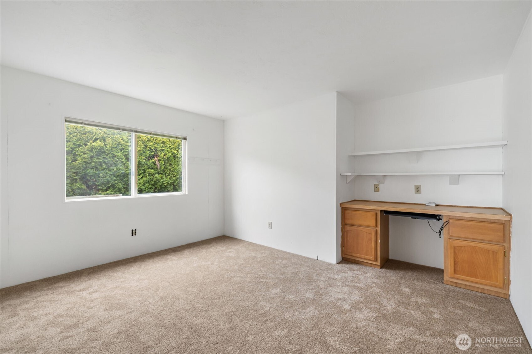 836 Harman Way South, Unit 33 Orting, WA 98360 - Photo 19 of 30 a view of an empty room with a window