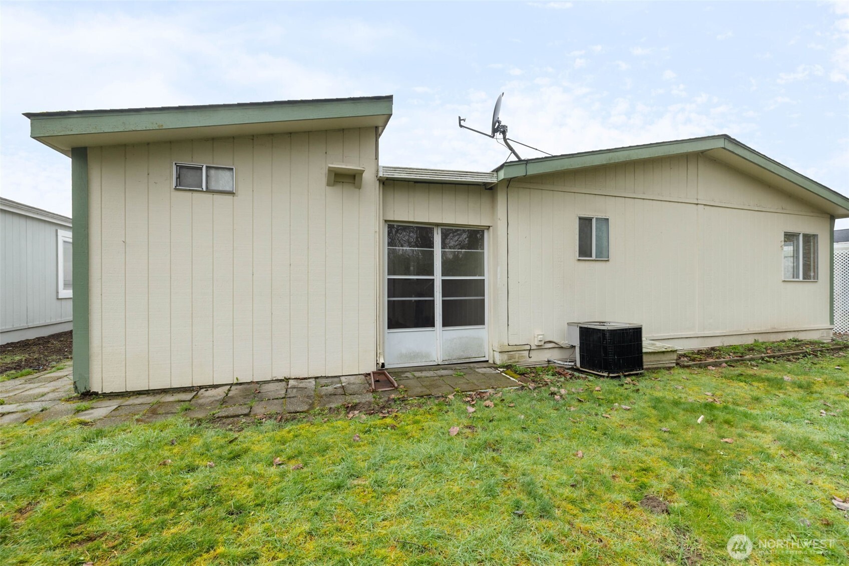 836 Harman Way South, Unit 33 Orting, WA 98360 - Photo 28 of 30 a house with yard in front of it