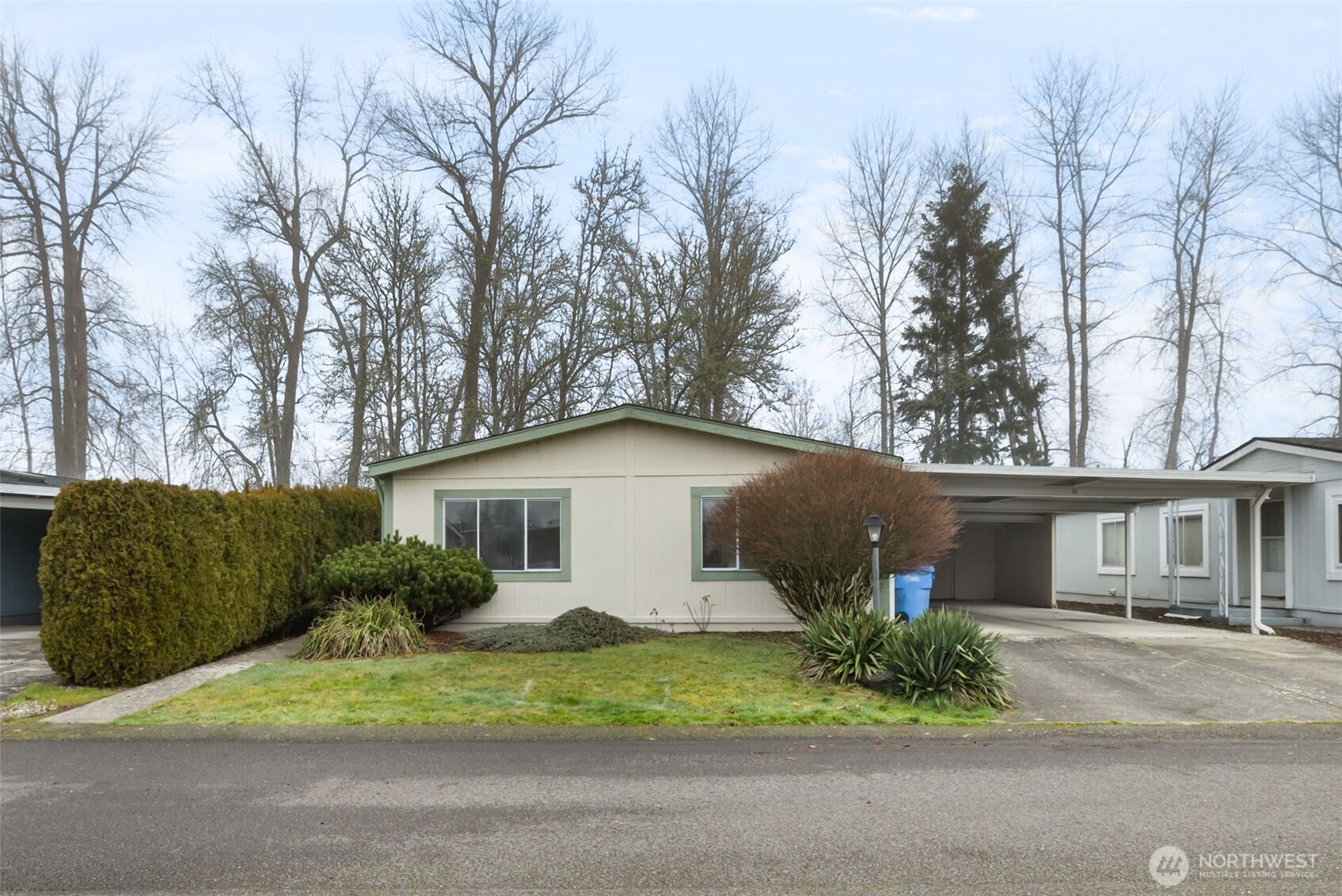 836 Harman Way South, Unit 33 Orting, WA 98360 - Photo 29 of 30 a house that has a tree in front of it