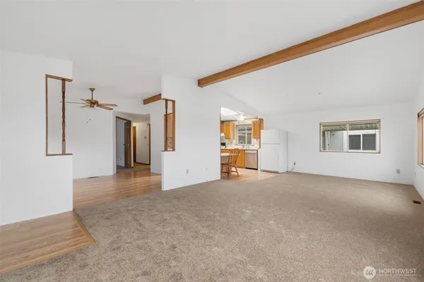 a view of a big room with closet and windows