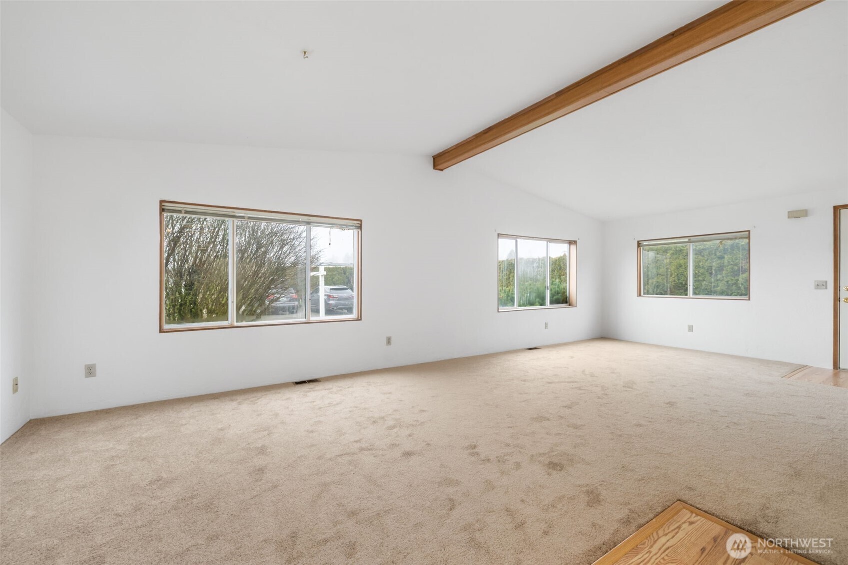 836 Harman Way South, Unit 33 Orting, WA 98360 - Photo 6 of 30 a view of an empty room with a window
