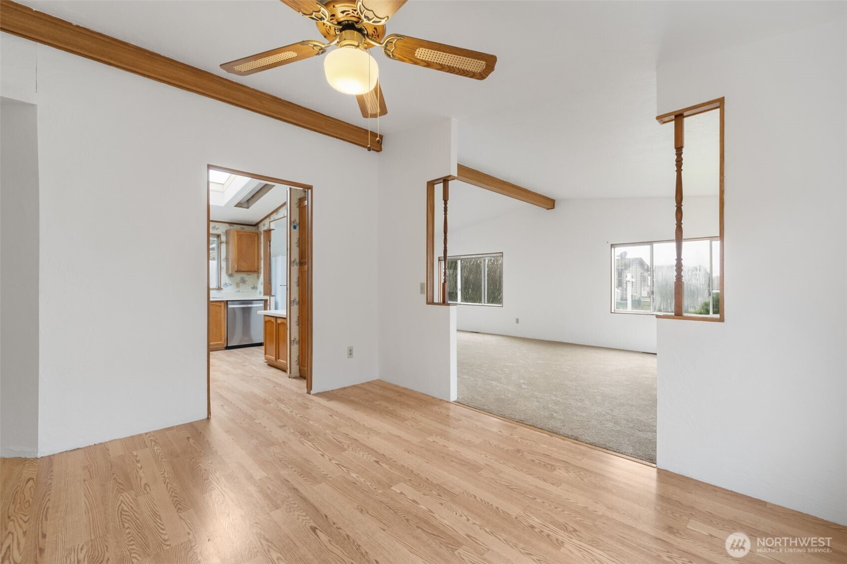 836 Harman Way South, Unit 33 Orting, WA 98360 - Photo 10 of 30 wooden floor in an empty room with a window