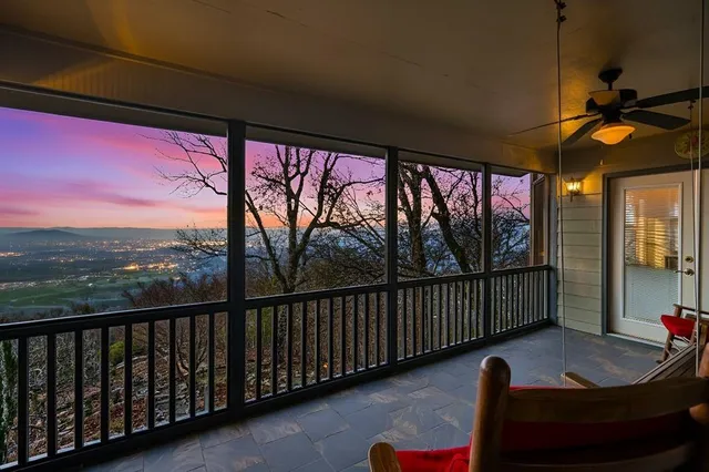 a view of a balcony with chairs
