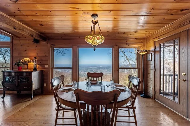a bedroom with a bed window and a potted plant