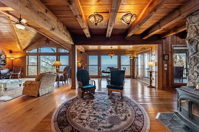 a utility room with stainless steel appliances granite countertop a sink and a window