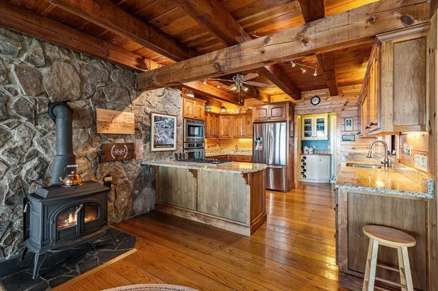 a bed room with a bed and a chair