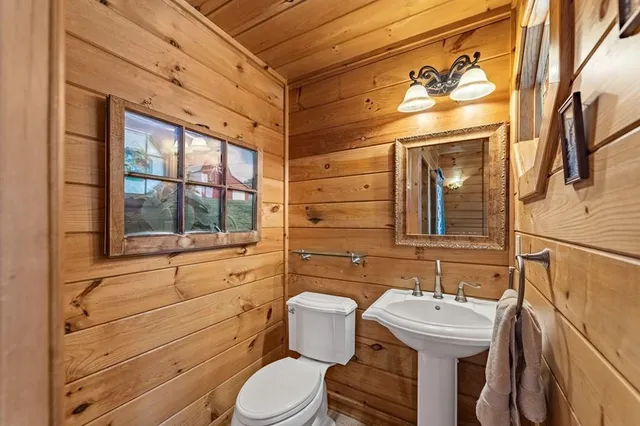 a view of patio with table and chairs with wooden floor and fence